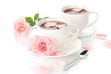 Cups of tea with roses isolated on white clipart
