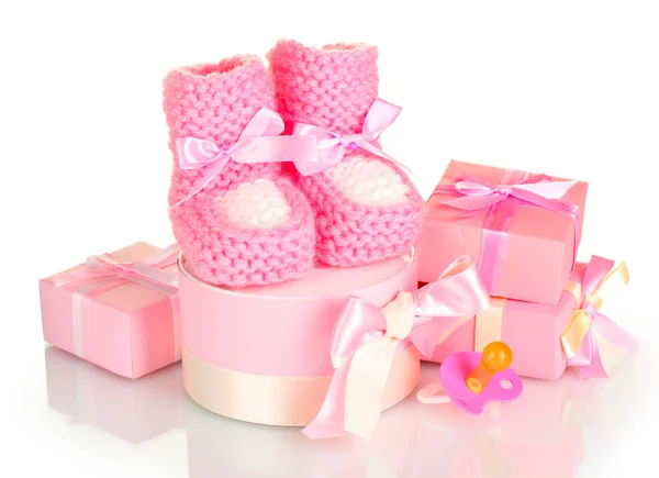 Pink baby boots, pacifier and gifts isolated on white — Stock Photo, Image