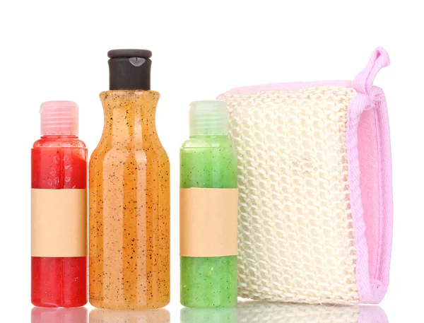 Bottles with scrub and sponge isolated on white — Stock Photo, Image