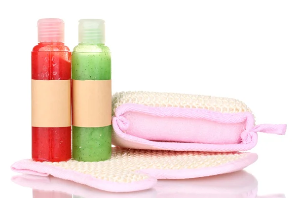 Bottles with scrub and sponges isolated on white — Stock Photo, Image