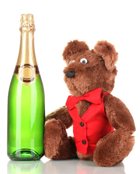 Іграшковий ведмідь і пляшка шампанського ізольовані на білому — стокове фото
