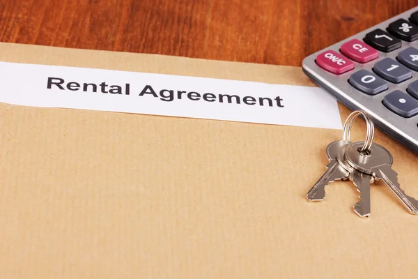 Rental agreement on wooden background close-up — Stock Photo, Image