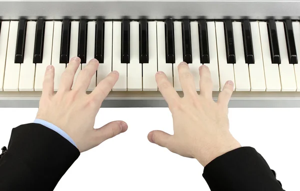 Hands of man playing piano — Stock Photo, Image