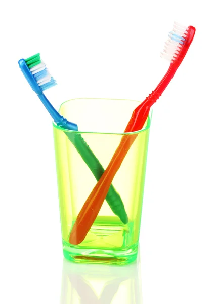 Toothbrushes in glass isolated on white — Stock Photo, Image