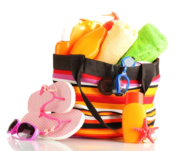 Beach bag with beach accessories, isolated on white — Stock Photo, Image