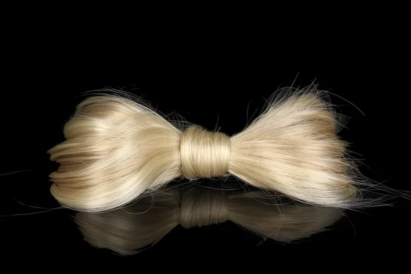 Shiny blond hair-pin isolated on black — Stock Photo, Image