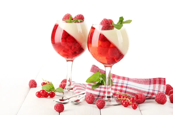 stock image Fruit jelly with berries in glasses on wooden table