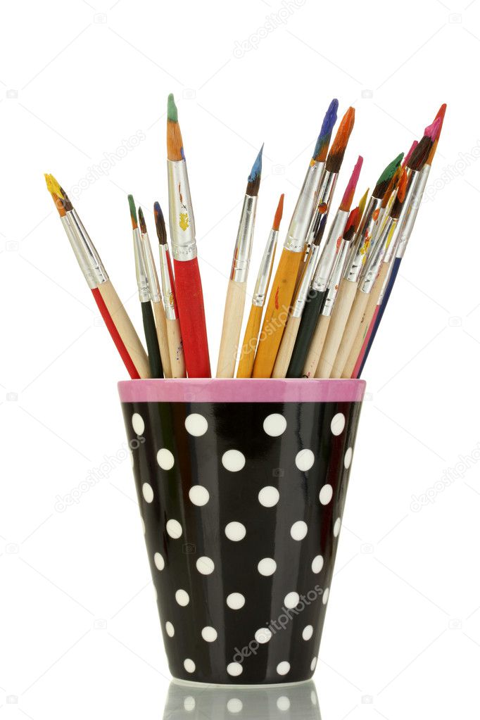 Paint brushes with gouache in cup isolated on white Stock Photo by