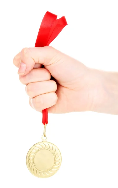 Złoty medal w ręku na białym tle na biały — Zdjęcie stockowe