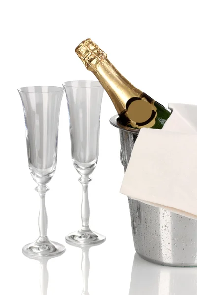 Champagne bottle in bucket with ice and glasses isolated on white — Stock Photo, Image