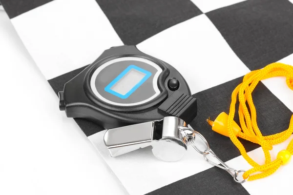 Checkered finish flag with whistle and stopwatch isolated on white — Stock Photo, Image