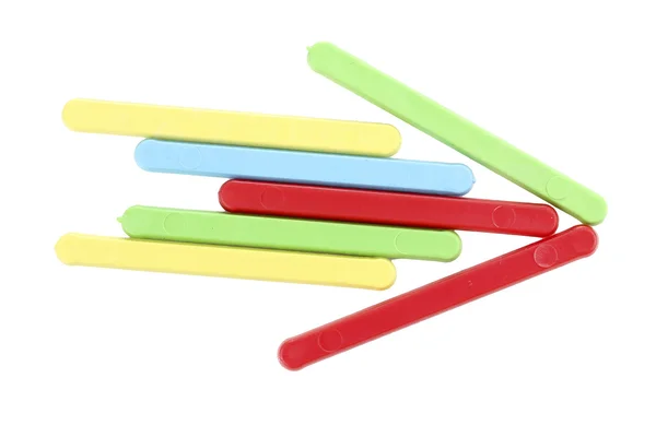 Цветные палочки сформированные стрелки изолированы на белом — стоковое фото