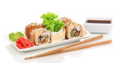 Tasty rolls served on white plate with chopsticks isolated on white clipart