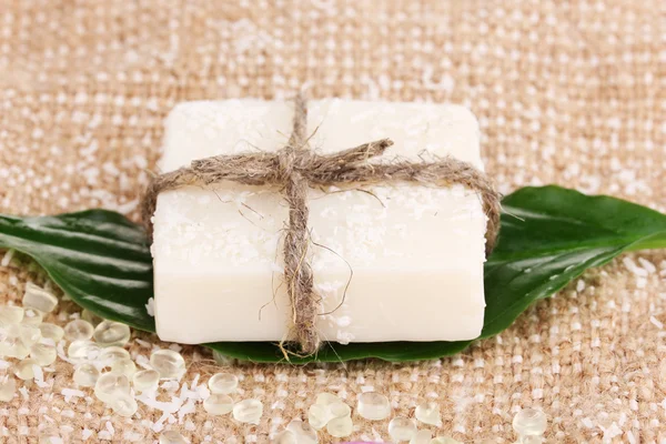 Hand-made herbal soap on sackcloth — Stock Photo, Image