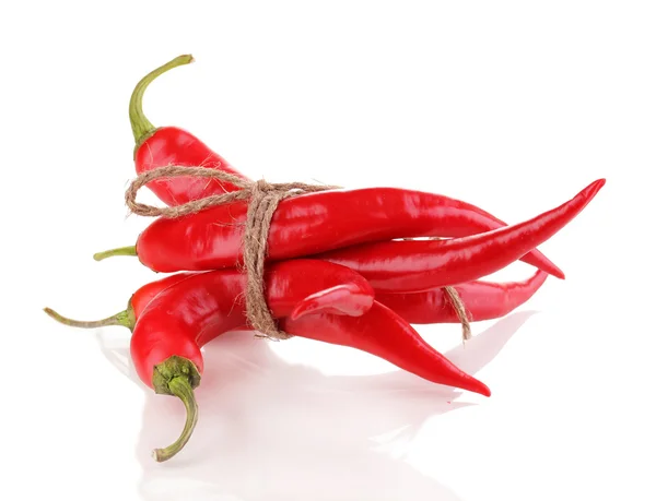 Red hot chili peppers bunden med rep isolerad på vit — Stockfoto
