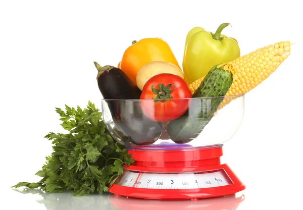 Ripe fresh vegetables in the kitchen scales isolated on white — Stock Photo, Image