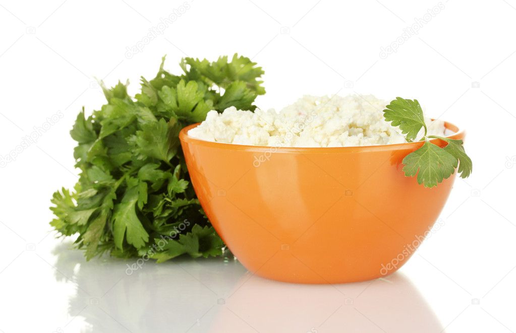 Cottage cheese with parsley in orange bowl isolated on white