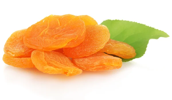 Delicious dried apricots on green leaf isolated on white — Stock Photo, Image