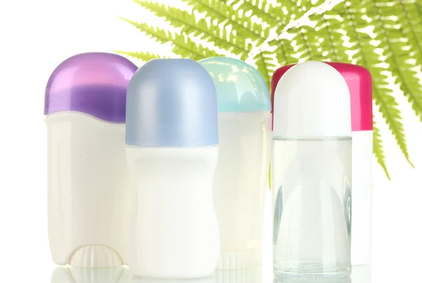 Desodorantes con hoja verde aislada sobre blanco —  Fotos de Stock