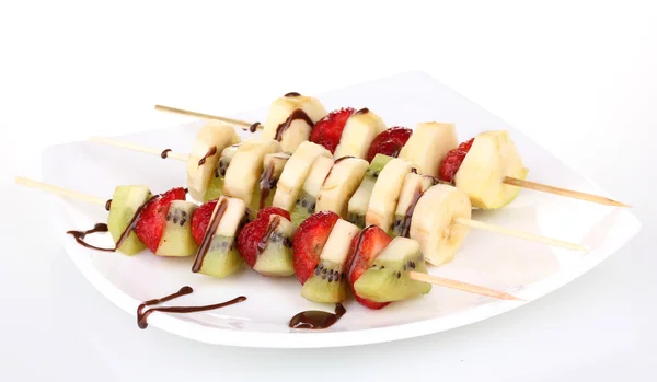Mixed fruits and berries on skewers with chocolate isolated on white — Stock Photo, Image