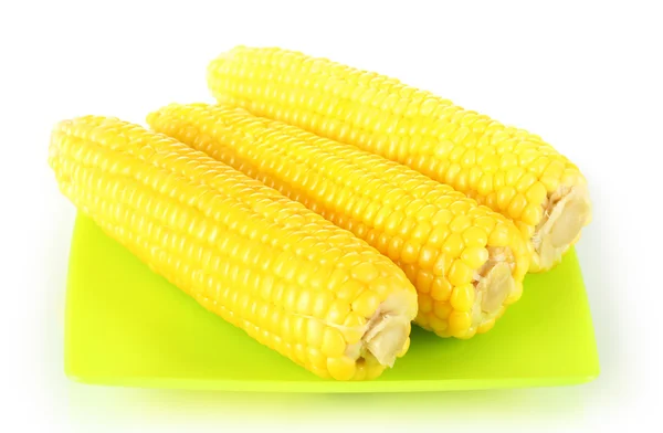 Boiled corn isolated on white on the green plate — Stock Photo, Image
