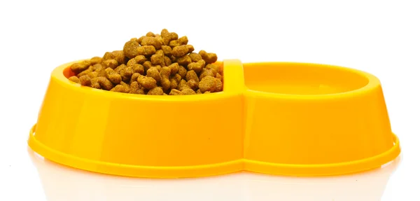Dry cat food and water in yellow bowl isolated on white — Stock Photo, Image