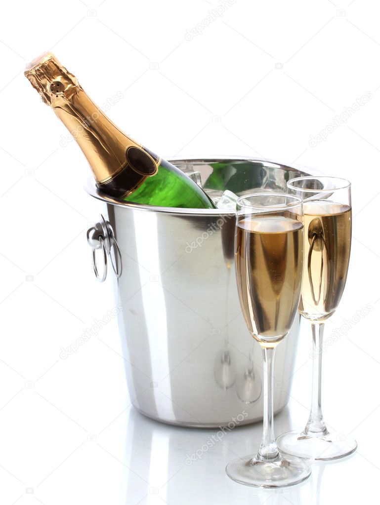 Champagne bottle in bucket with ice and glasses of champagne