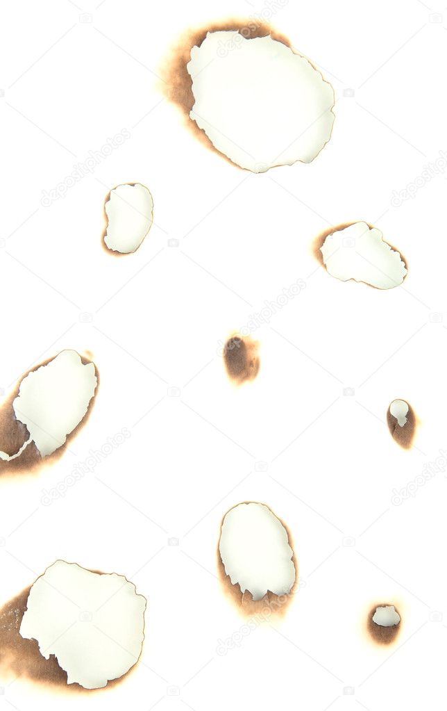 Burnt holes in white paper isolated on white