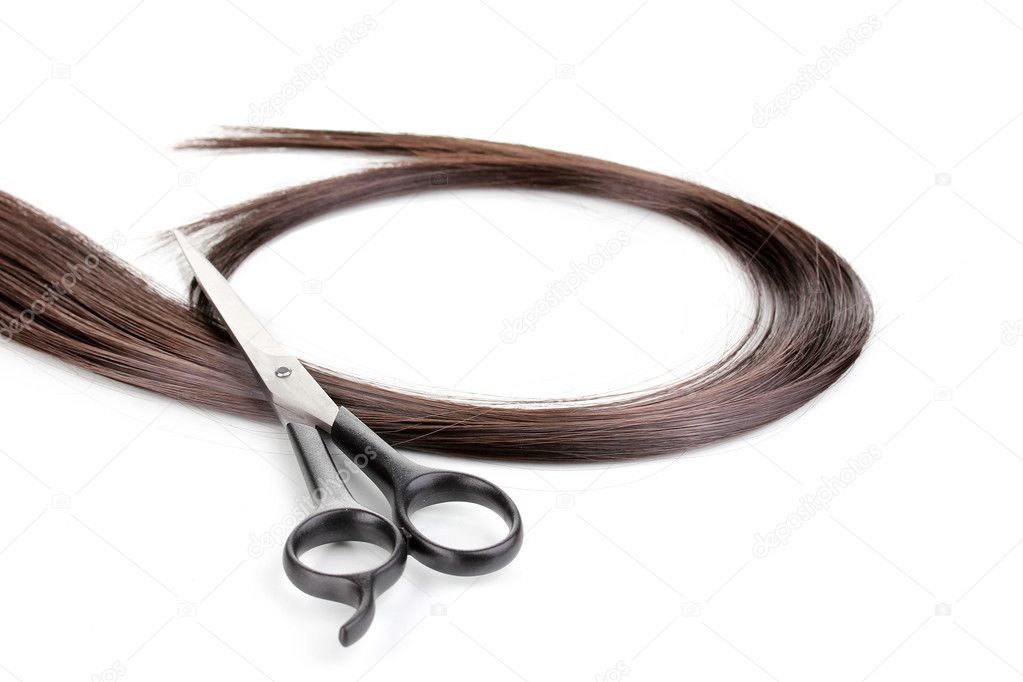 Shiny brown hair and hair cutting shears isolated on white