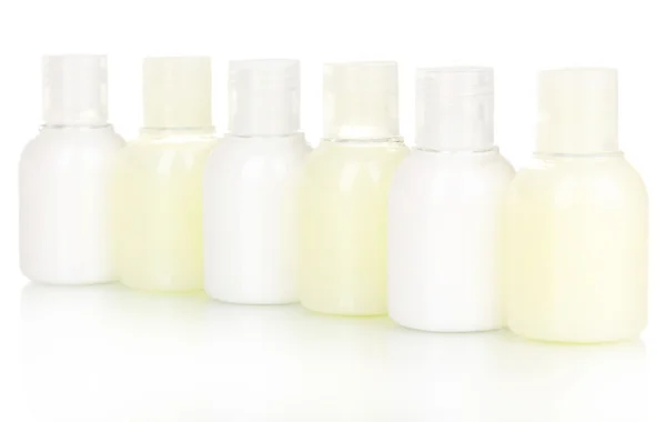 Hotel cosmetic bottles isolated on white — Stock Photo, Image