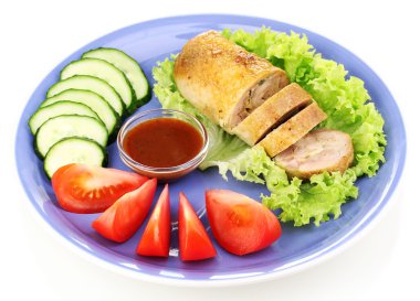 Tasty meat cutlet with garnish on plate isolated on white