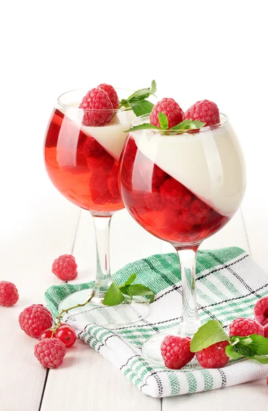 Fruit jelly with berries in glasses on wooden table — Stock Photo, Image