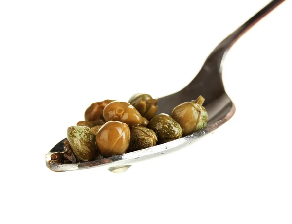 Green capers in metal spoon on white background close-up — Stock Photo, Image