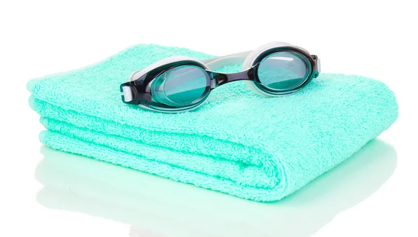 Swim goggles on towel isolated on white — Stock Photo, Image