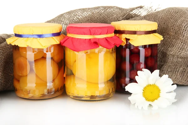 Jar with canned fruit on canvas background close-up — Stock Photo, Image