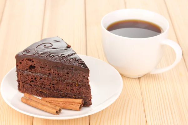 Chocolate sacher cake on wooden table — Stock Photo, Image