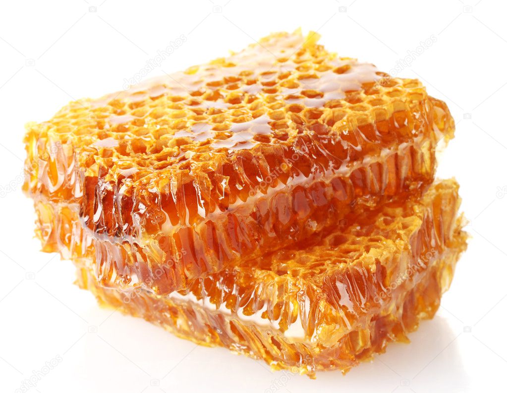 Sweet honeycombs with honey, isolated on white