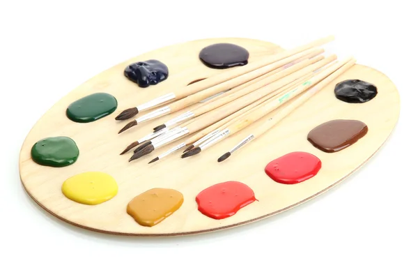 Tavolozza di arte in legno con vernice e pennelli isolati su bianco — Foto Stock