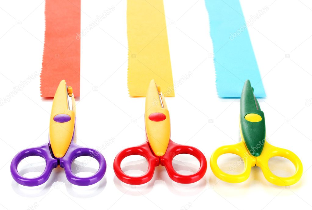 Colorful zigzag scissors with paper strips isolated on white