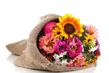 Beautiful bouquet of bright flowers in sacking isolated on white clipart