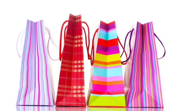 Světlé nákupní tašky izolované na bílém — Stock fotografie