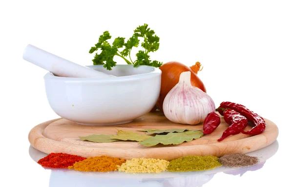 Composition of White mortar and pestle with spice and vegetables on cutting board isolated on white — Stock Photo, Image