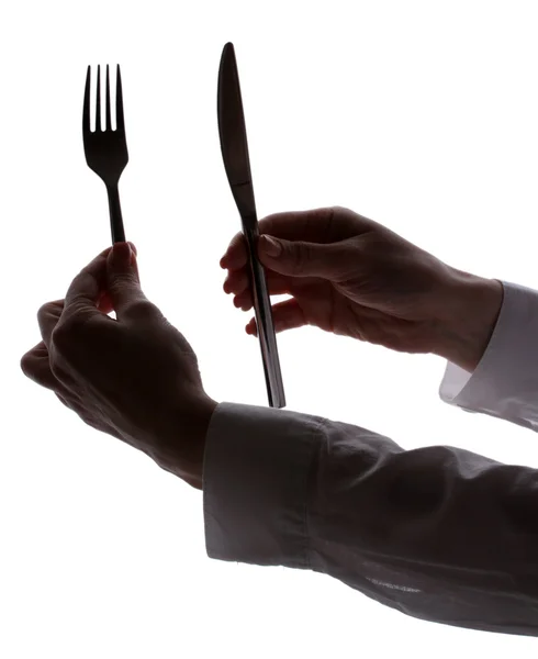 Silueta ženy rukou s vidličkou a nožem izolovaných na bílém — Stock fotografie