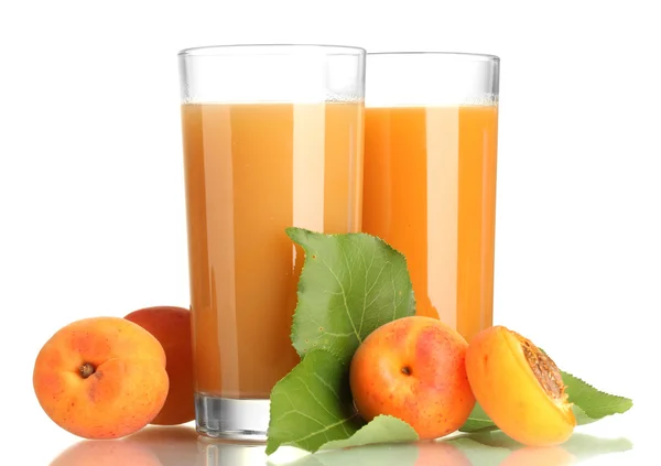 Two glasses of apricot juice and apricots with leaves isolated on white — Stock Photo, Image