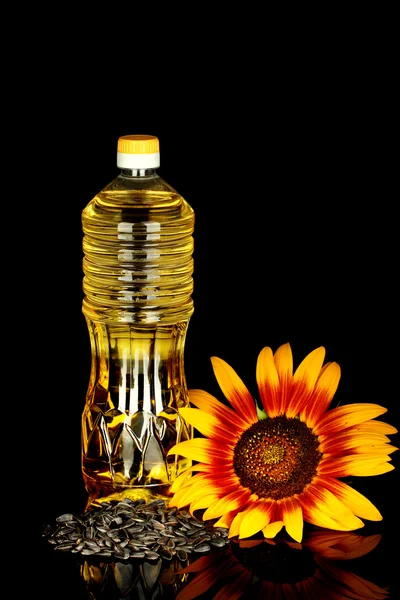 Sunflower oil in a plastic bottle isolated on black background — Stock Photo, Image
