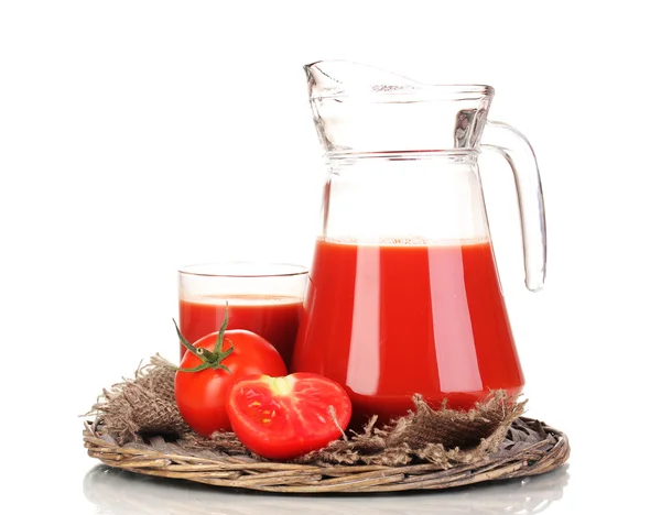 Tomato juice in pitcher and glass on wicker mat isolated on white — Stock Photo, Image