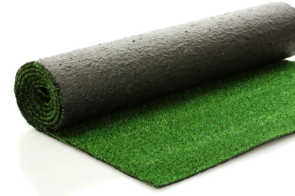 Césped verde laminado artificial, aislado en blanco — Foto de Stock
