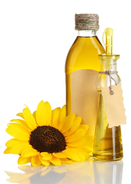 Oil in jars and sunflower, isolated on white — Stock Photo, Image