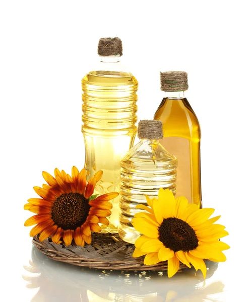 Oil in bottles and sunflowers, isolated on white — Stock Photo, Image