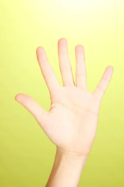 Semn de mână pe fundal verde — Fotografie, imagine de stoc